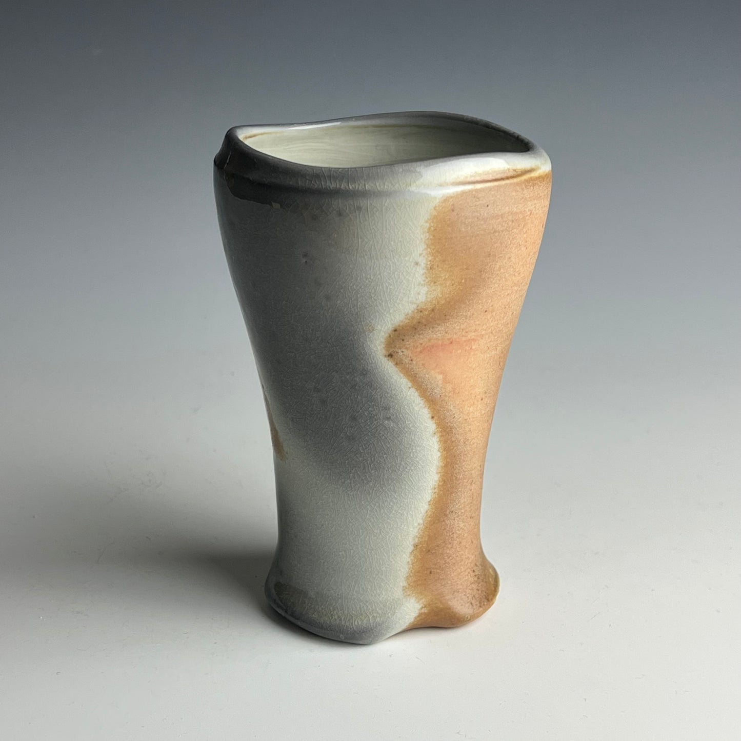 Porcelain tumbler decorated by a mug